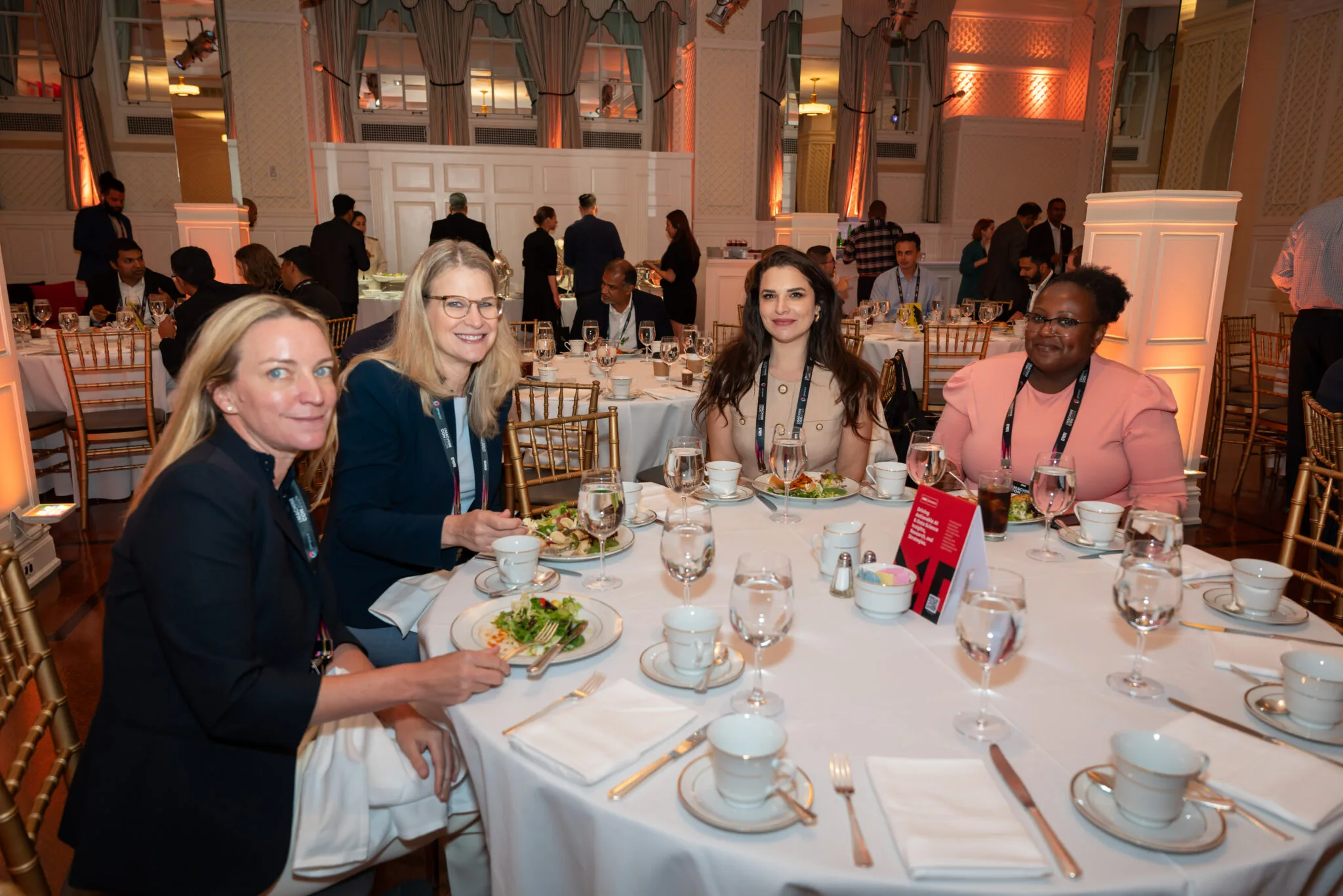 People seated at round table at MachineCon New York 2024