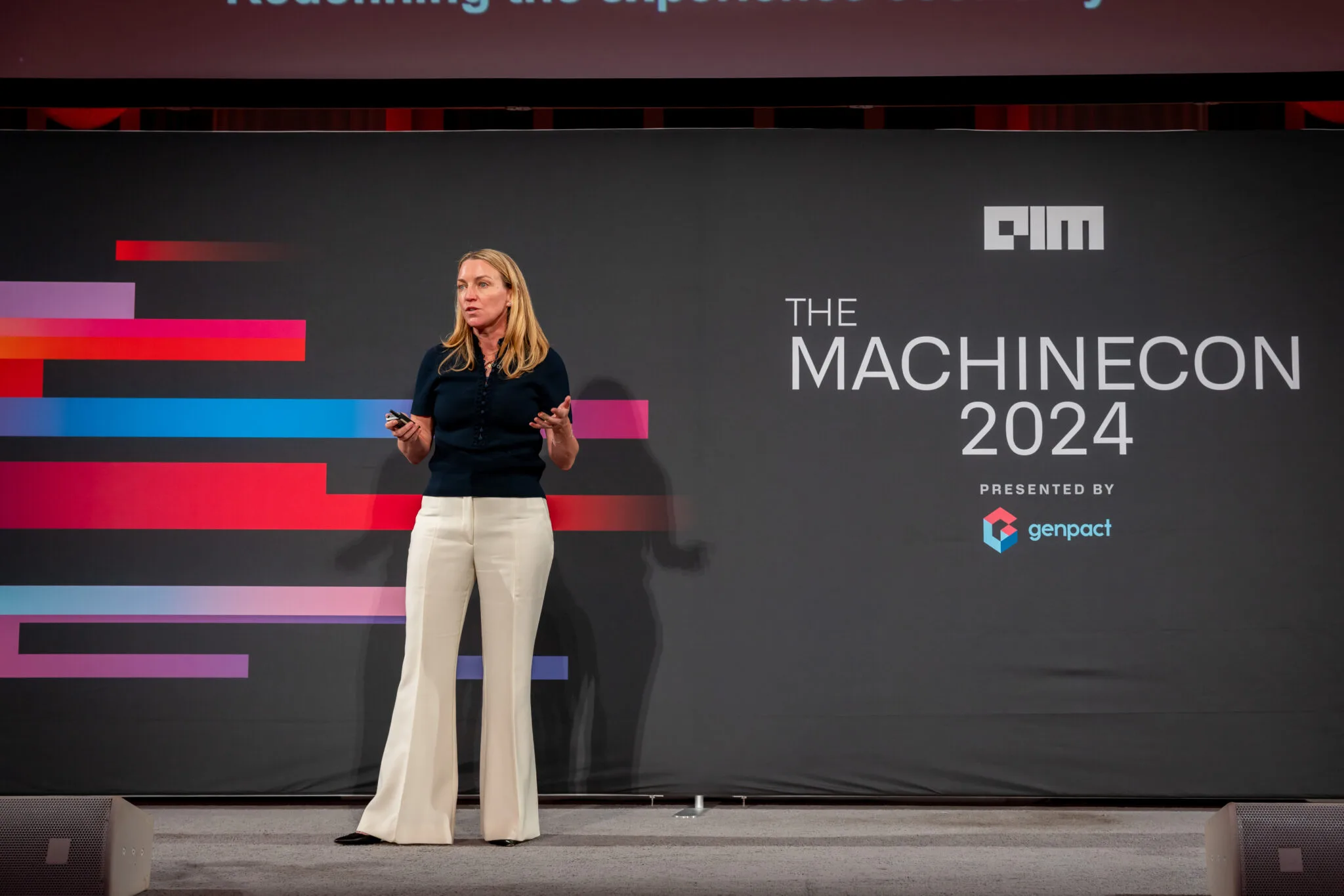 Speaker presenting on main stage at MachineCon New York 2024