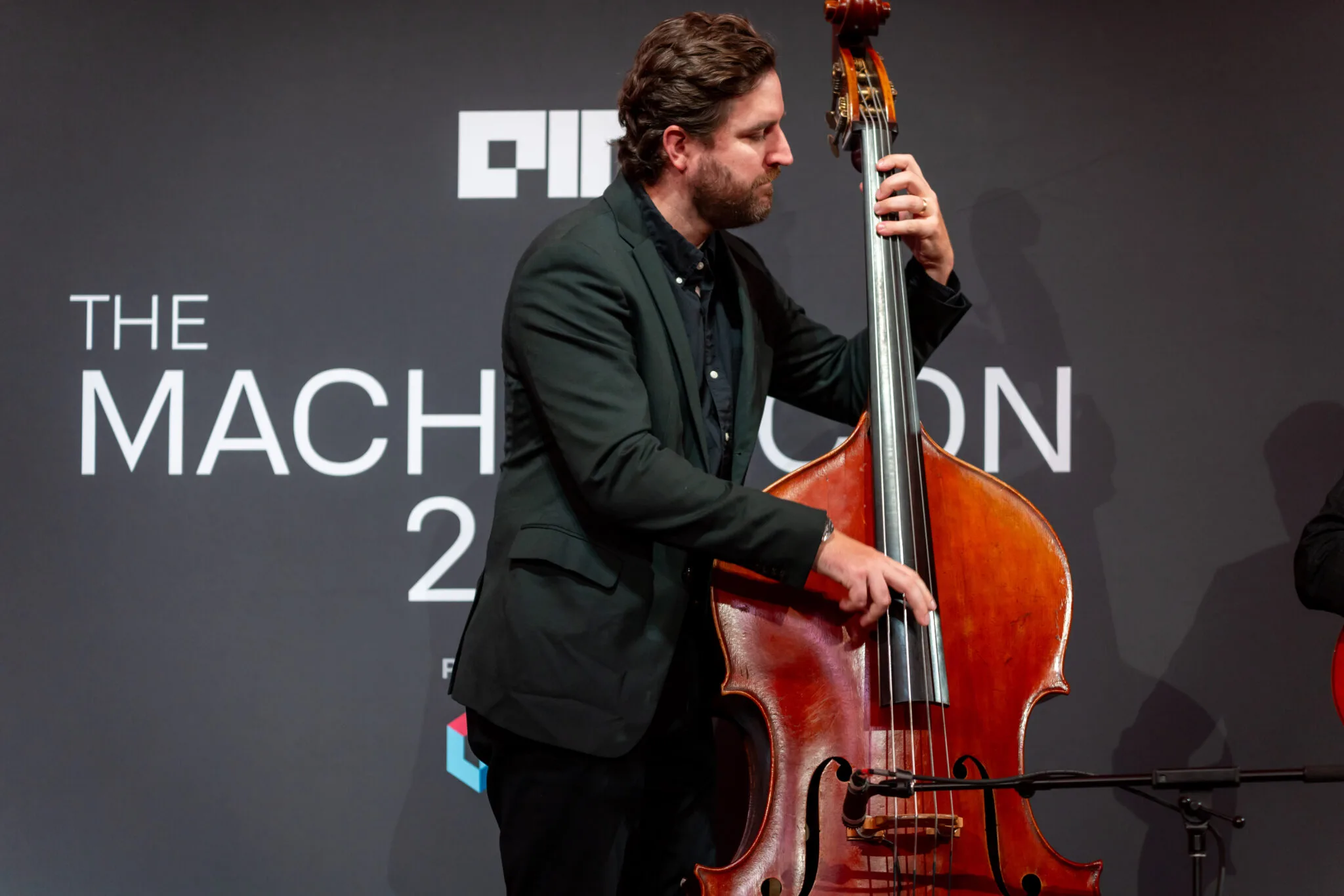 Musician playing double bass at MachineCon New York 2024