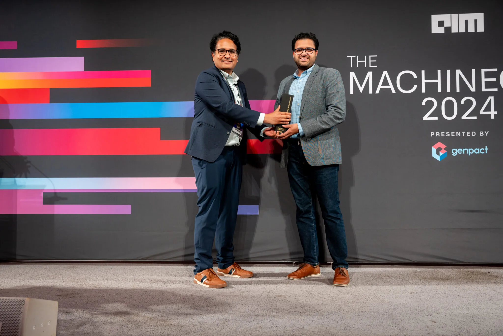 Receiving award on stage at MachineCon New York 2024