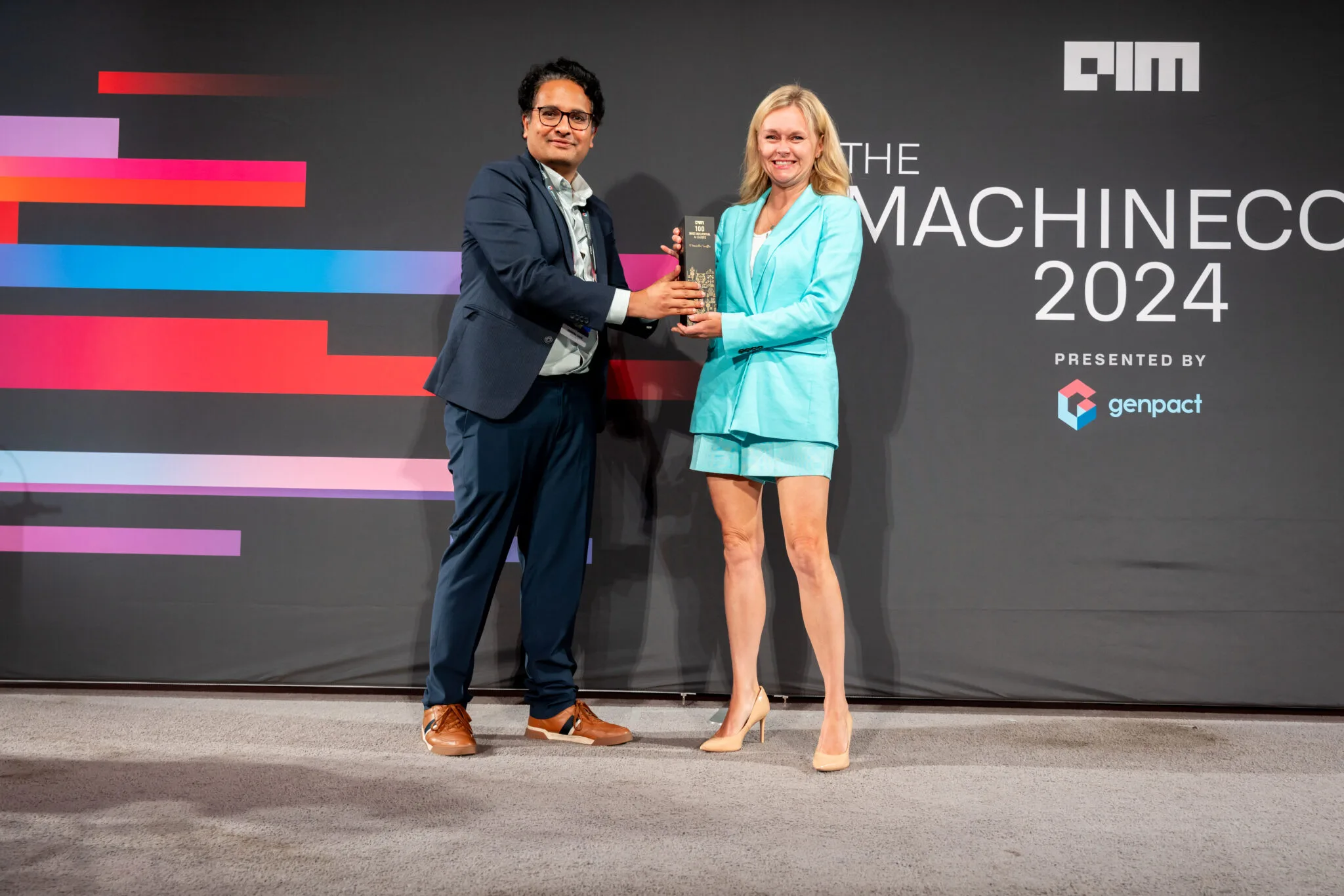 AI150 award presentation on stage at MachineCon New York 2024