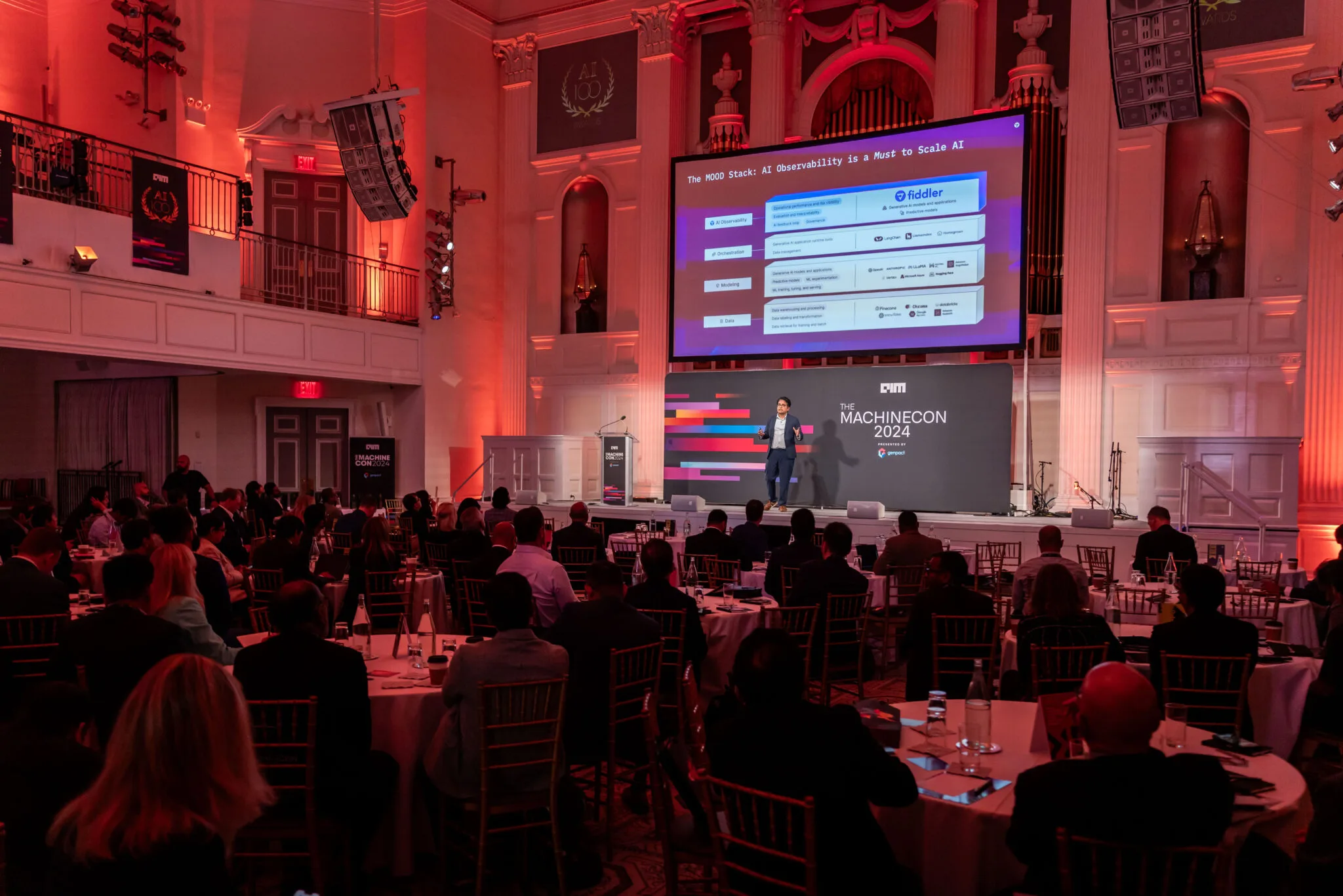 Speaker presenting on main stage at MachineCon New York 2024