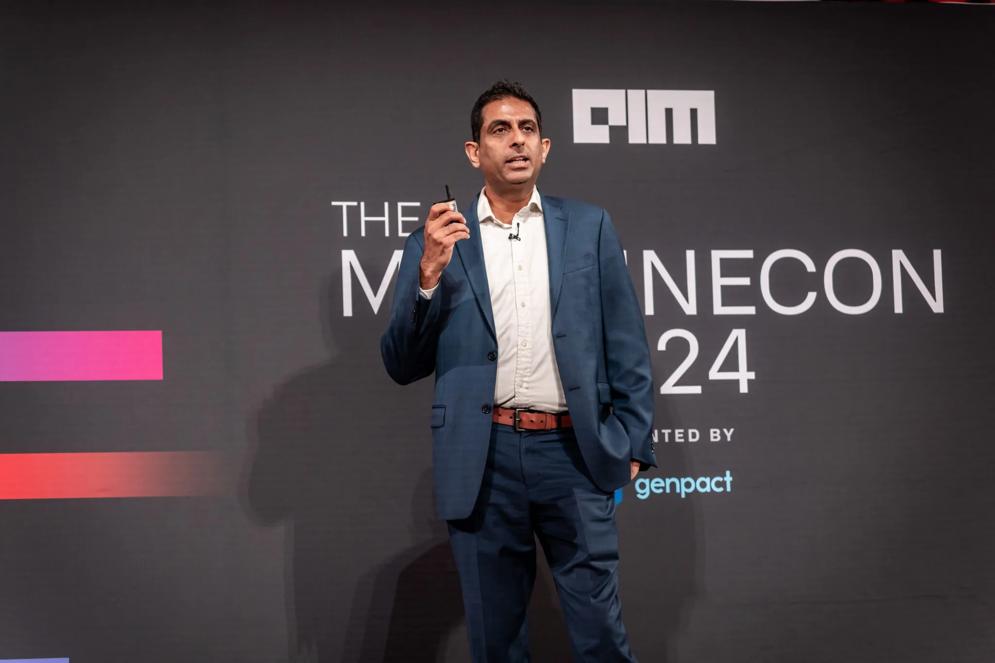 Speaker presenting on stage at MachineCon New York 2024