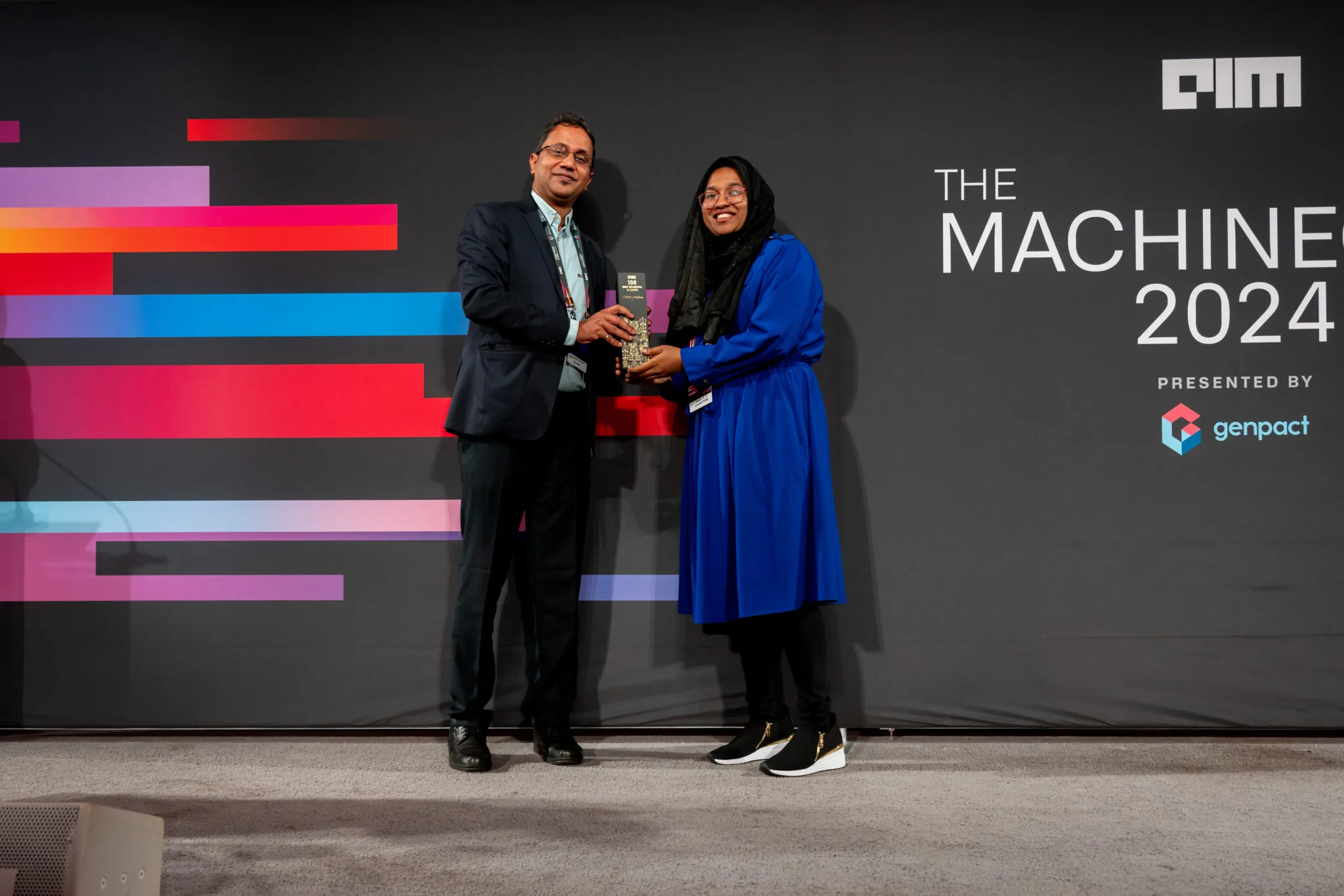 AI150 award presentation on stage at MachineCon New York 2024