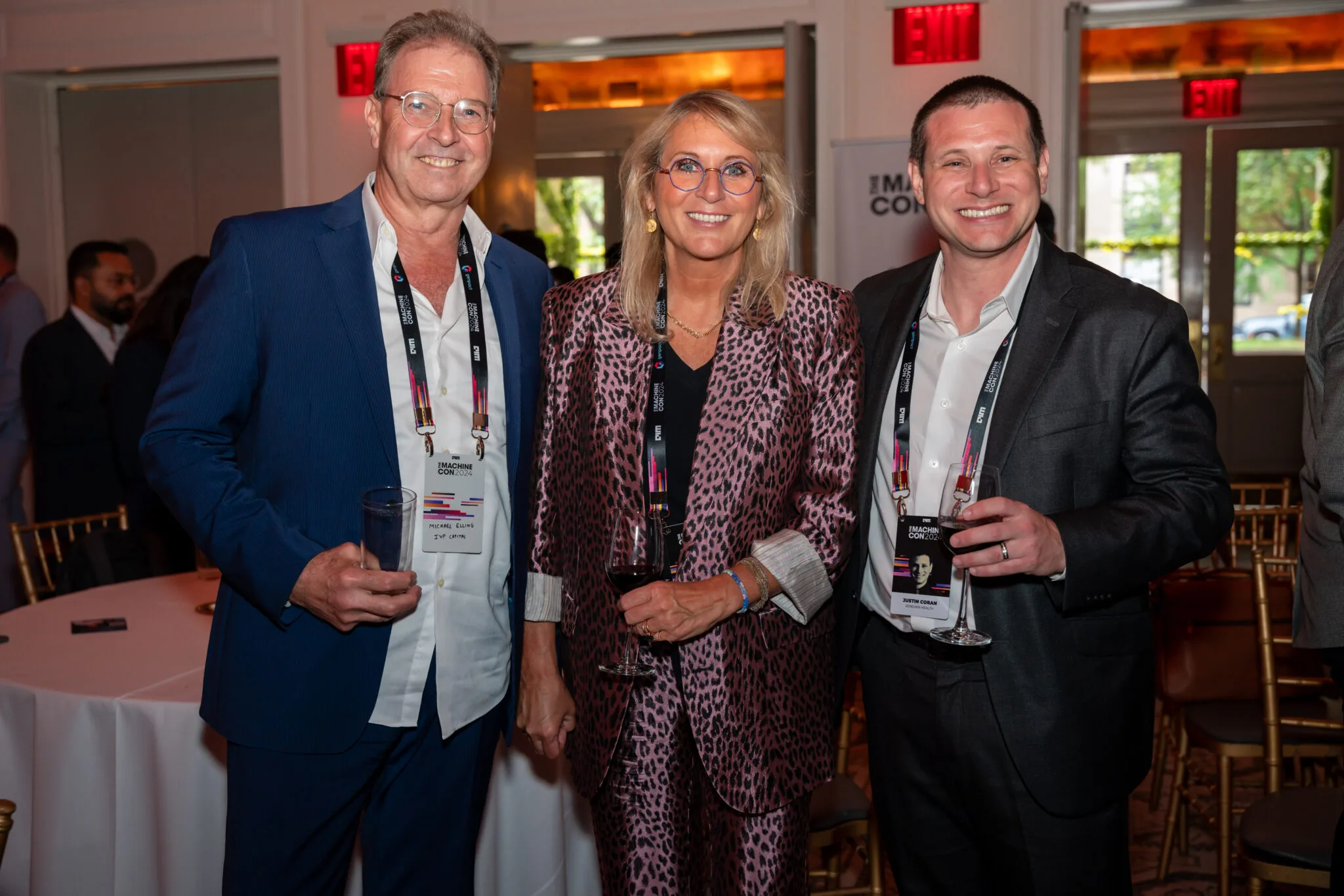 Attendees networking with drinks at MachineCon New York 2024