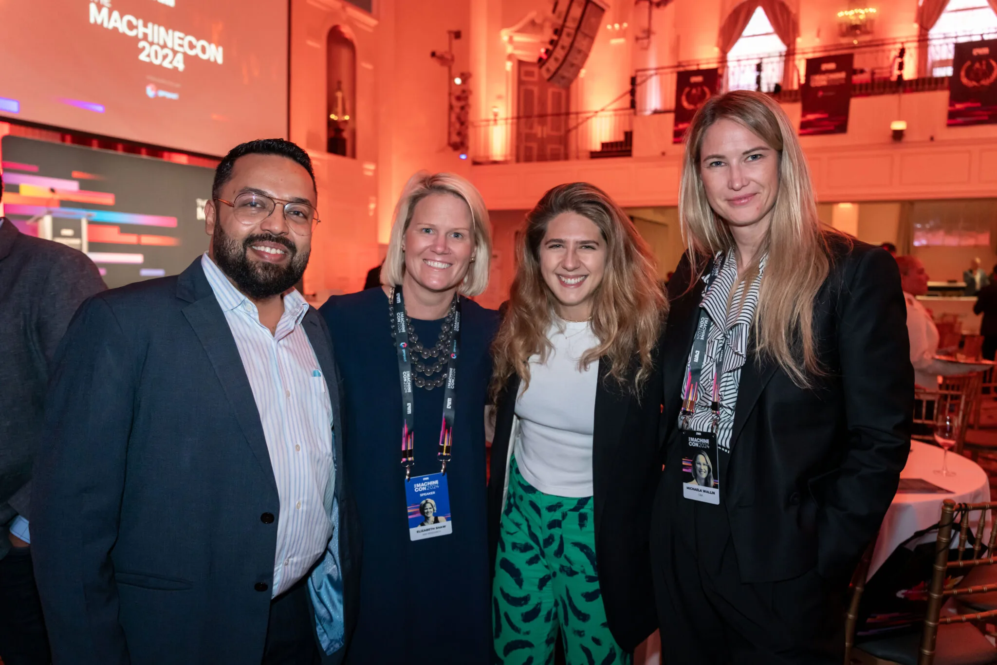 Smiling attendees posing together at MachineCon New York 2024