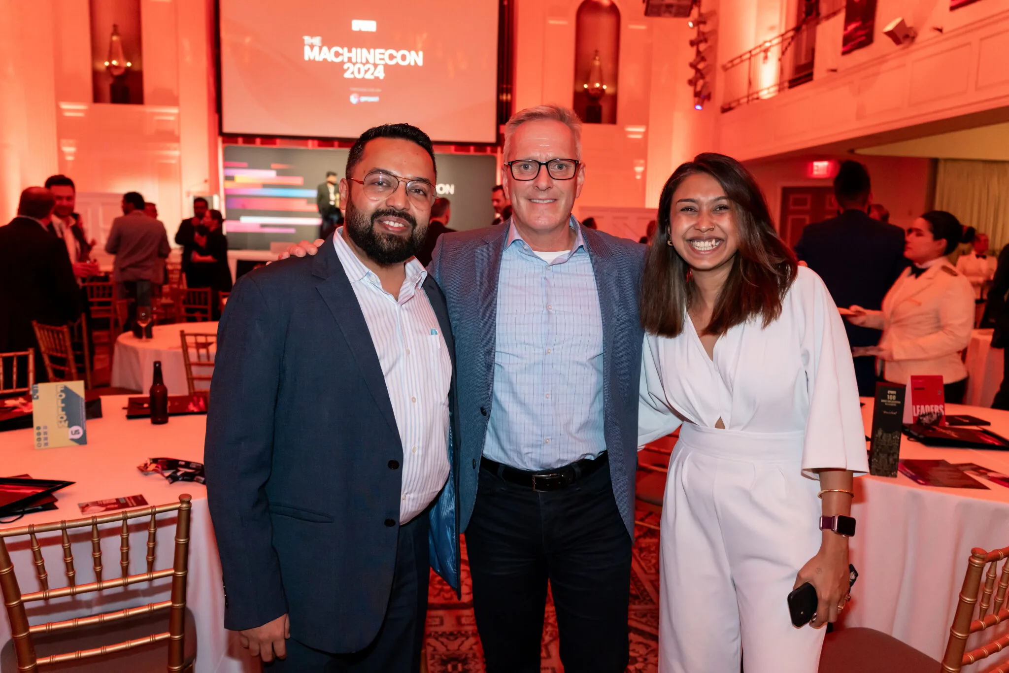 Attendees posing and networking at MachineCon New York 2024