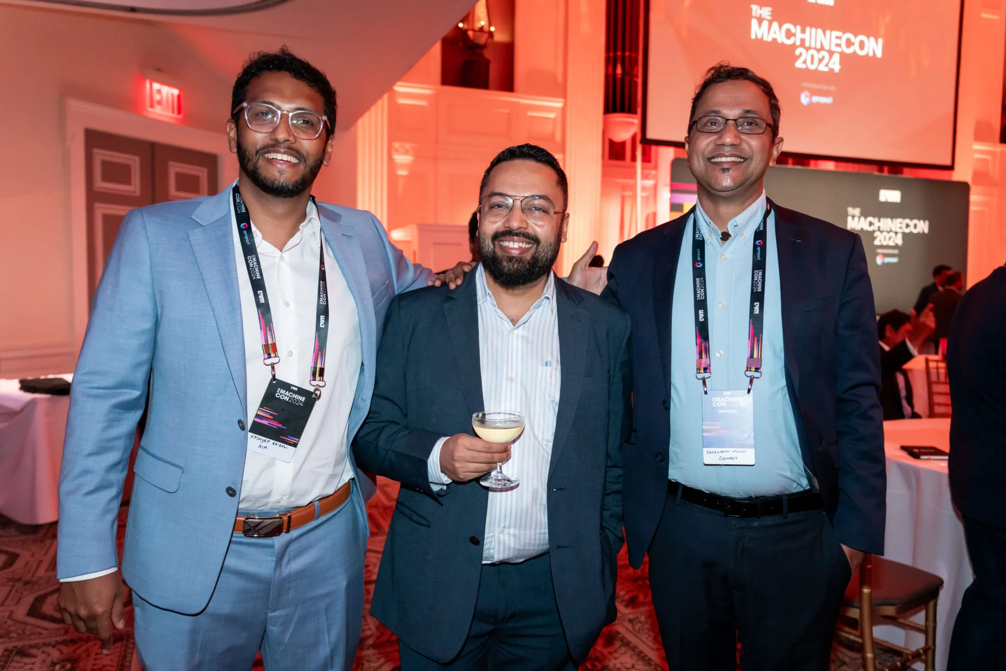 Three men networking at event at MachineCon New York 2024