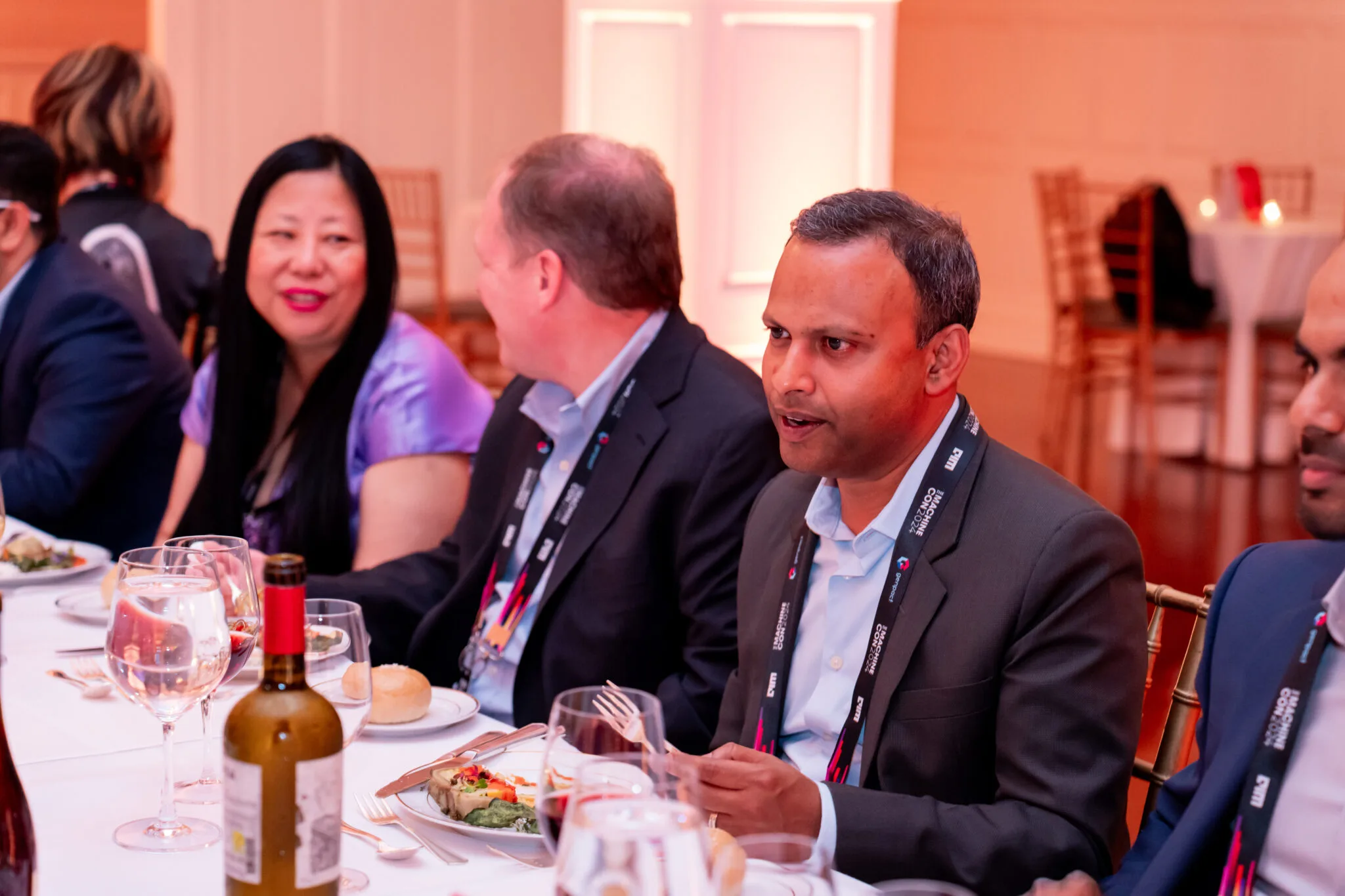 Attendees networking at dinner table at MachineCon New York 2024