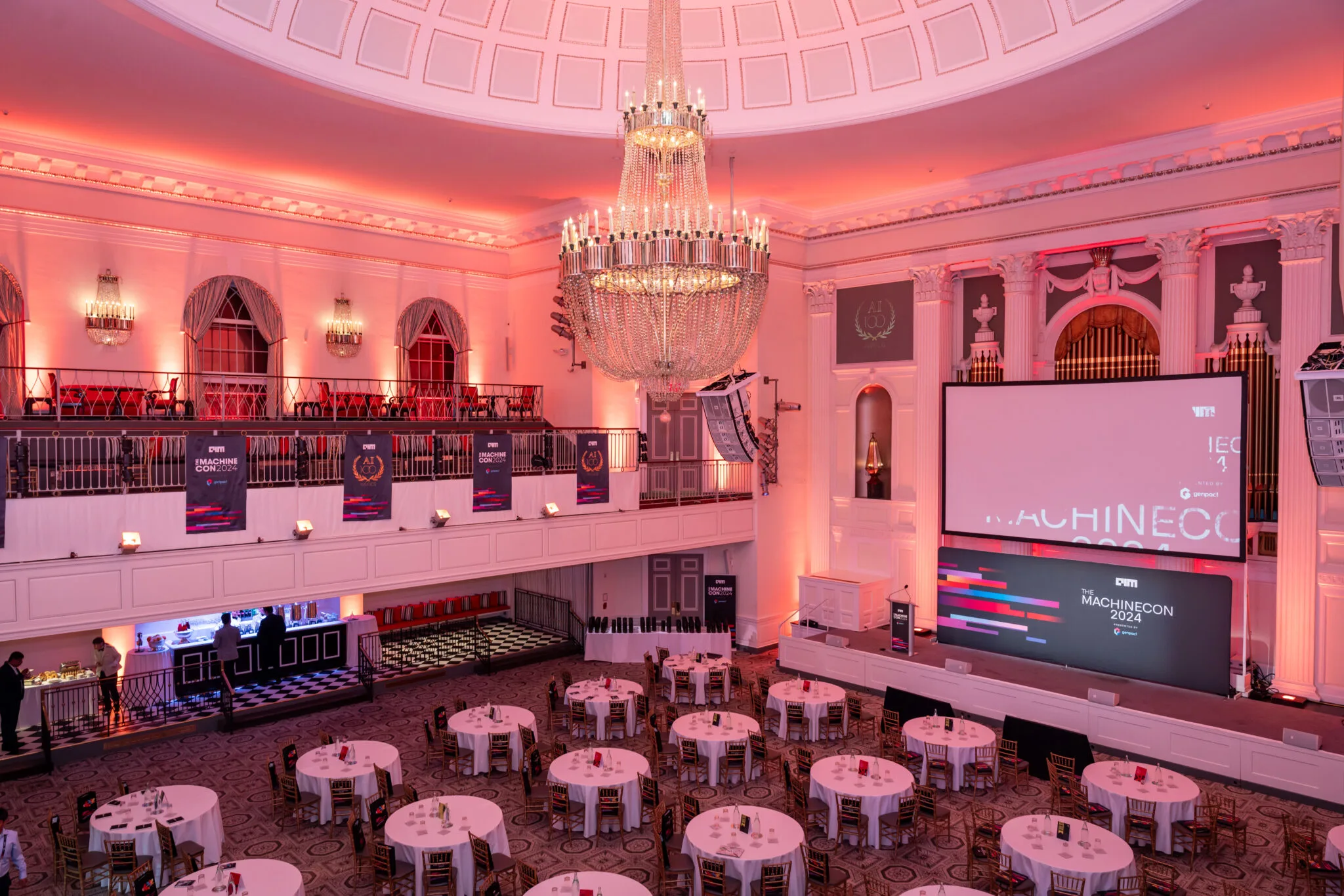 Conference hall setup with tables at MachineCon New York 2024