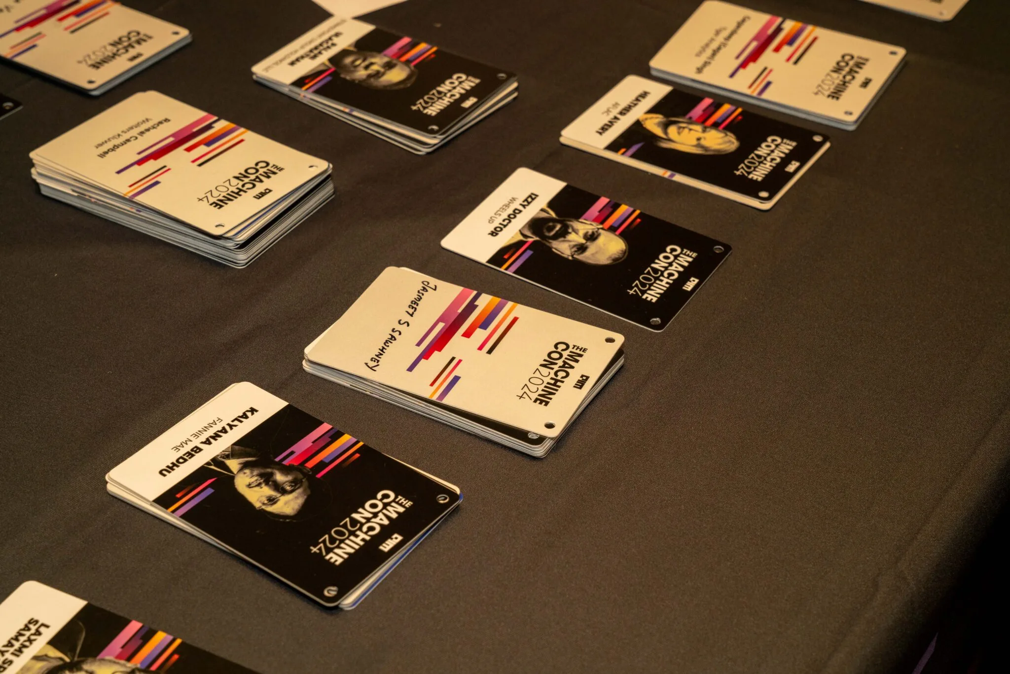 Event badges on a table at MachineCon New York 2024