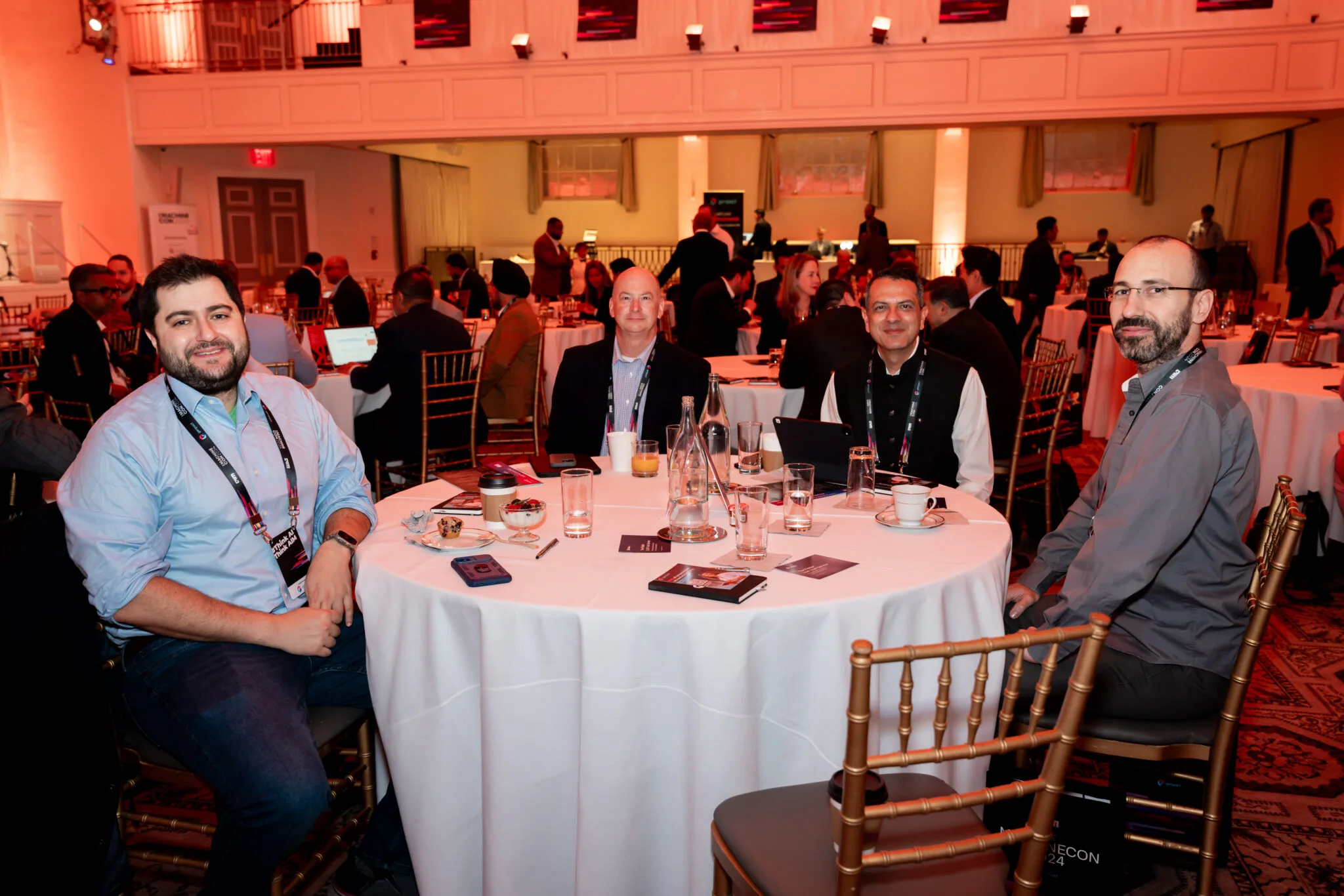 Attendees seated at round table at MachineCon New York 2024