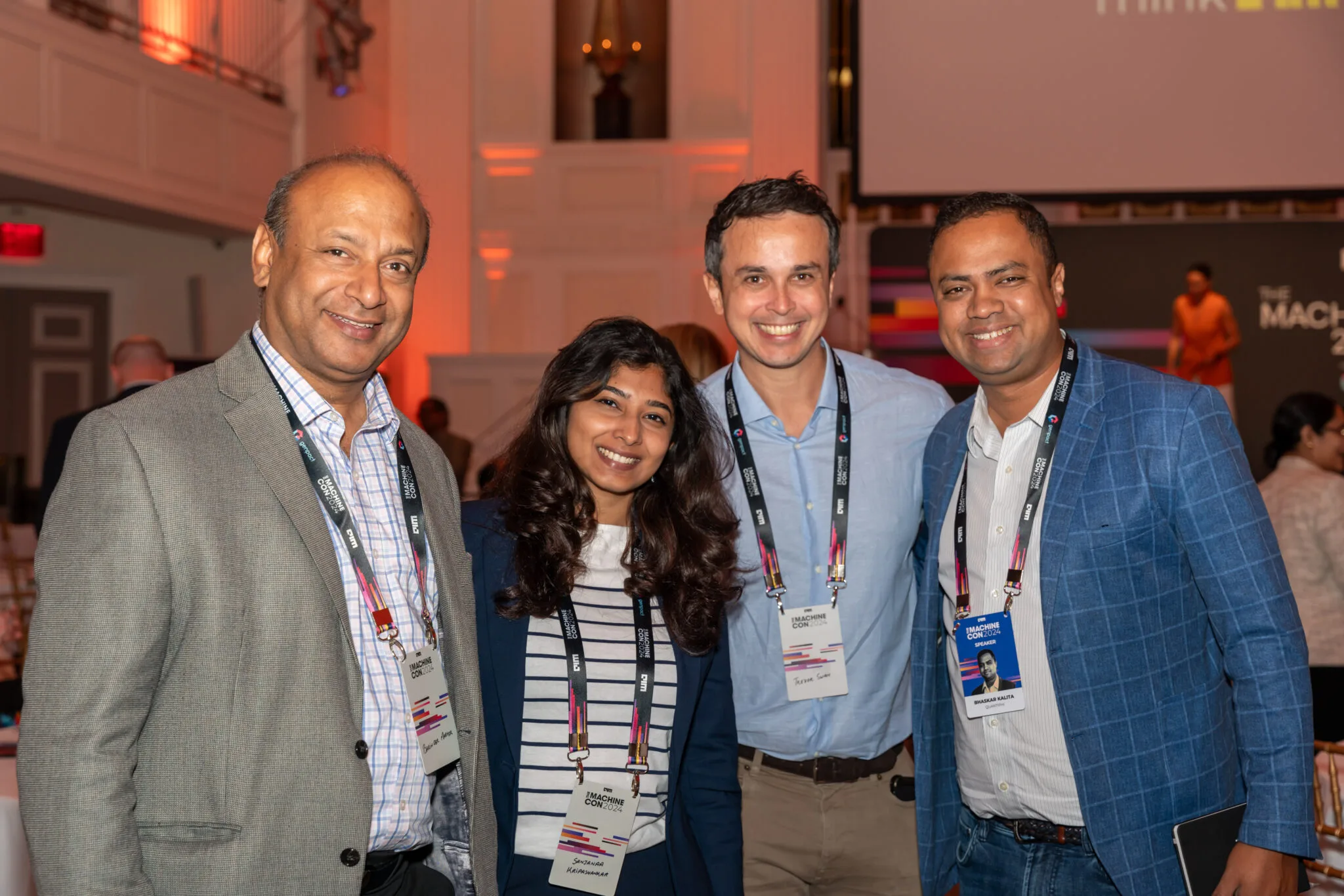 Group photo of four attendees at MachineCon New York 2024