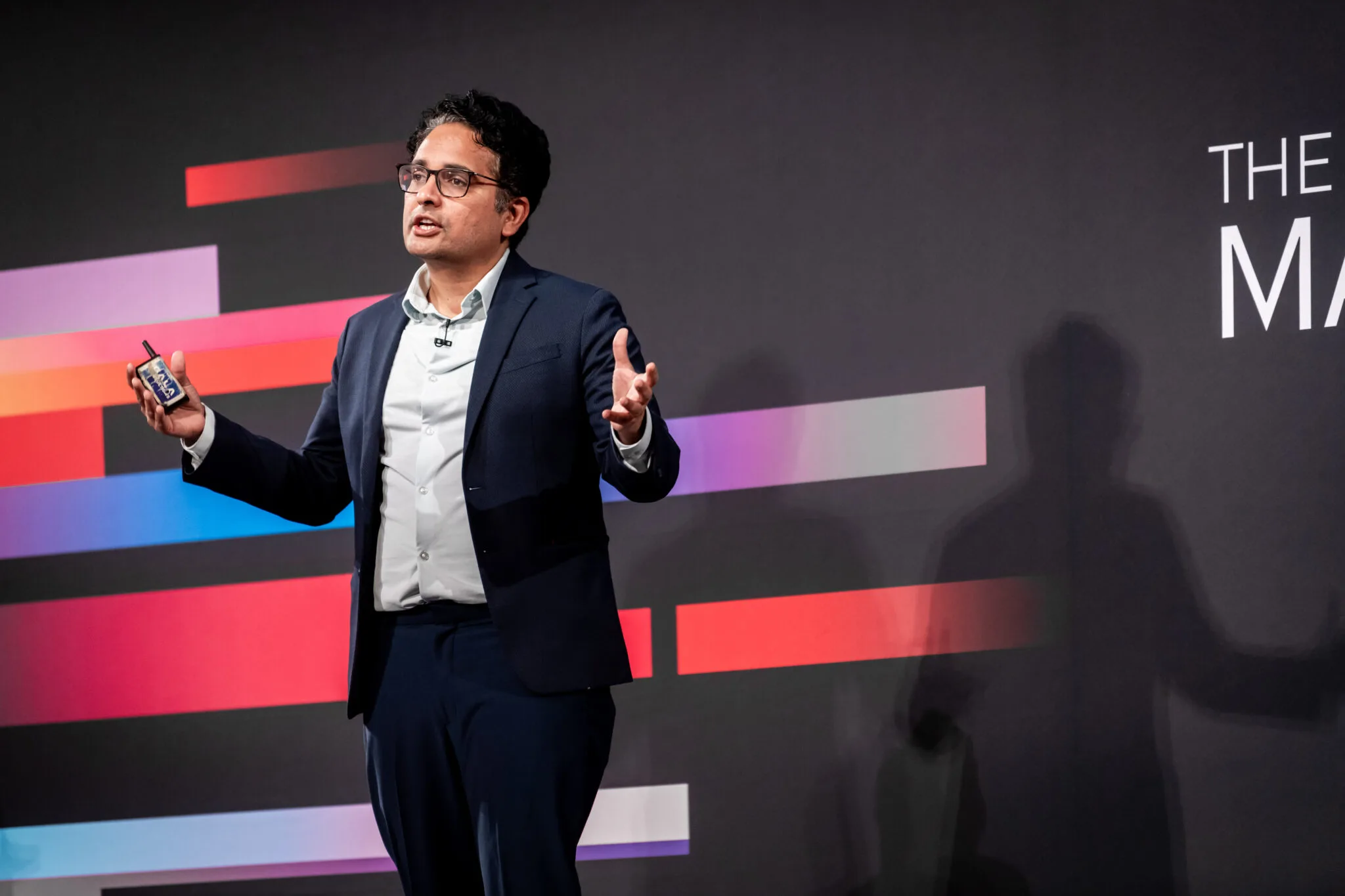 Speaker presenting on main stage at MachineCon New York 2024