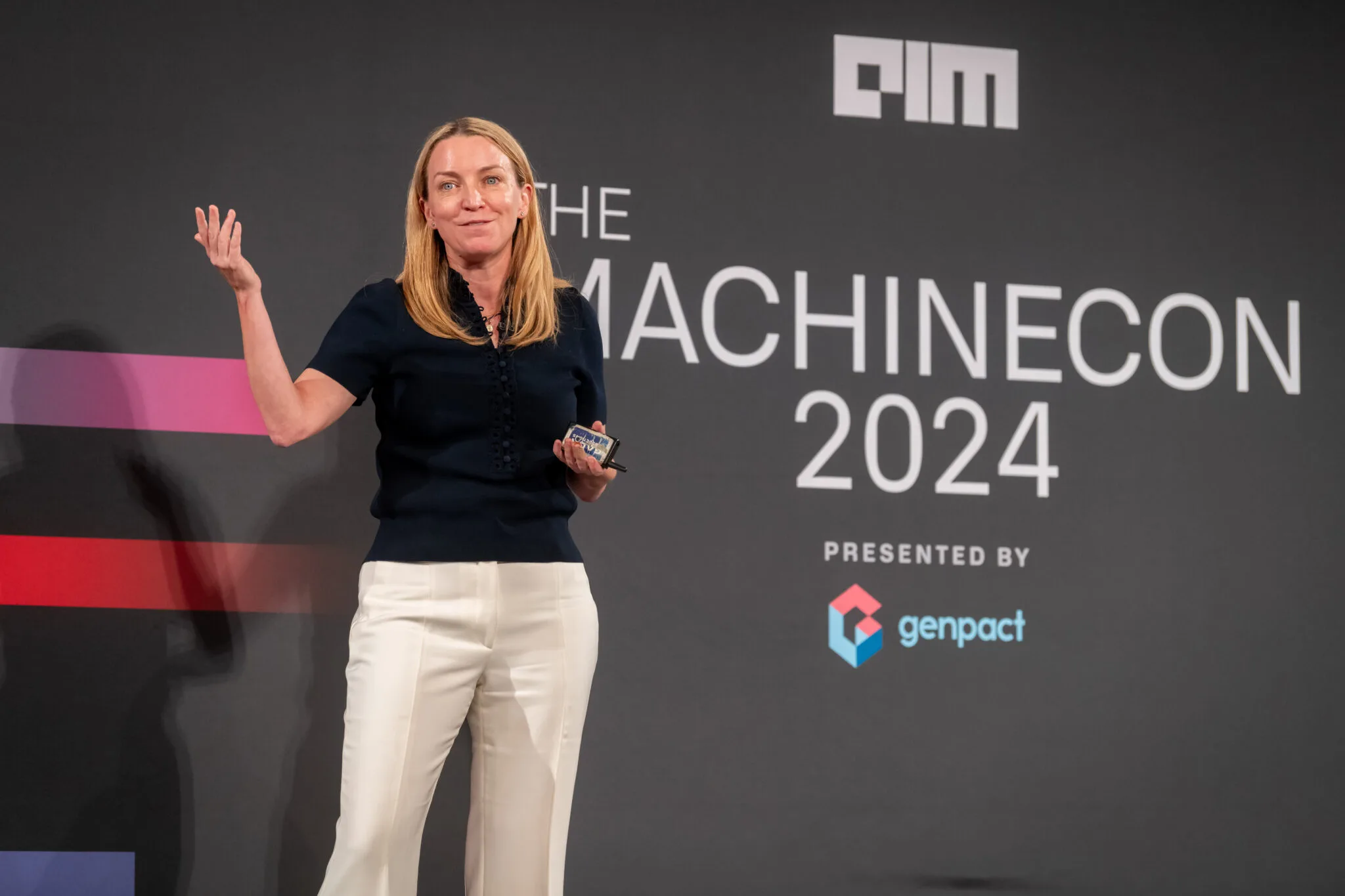 Speaker presenting on main stage at MachineCon New York 2024