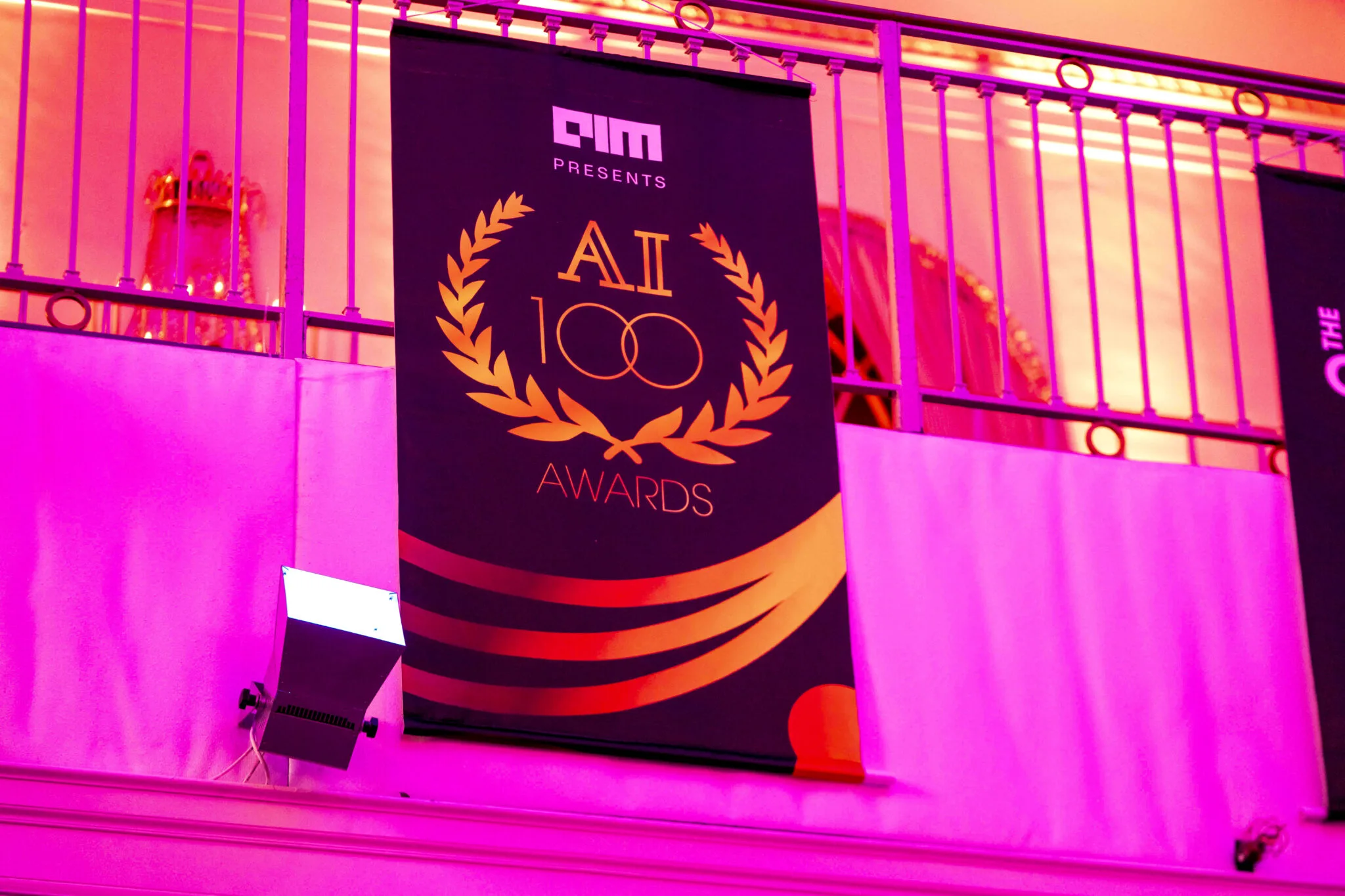 AI100 awards banner at MachineCon New York 2025
