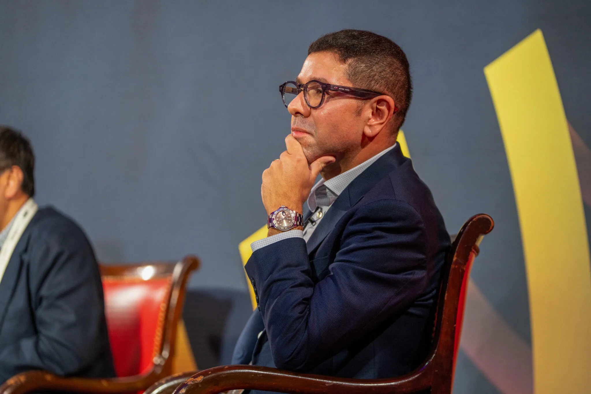 Attentive audience member in thought at MachineCon New York 2025