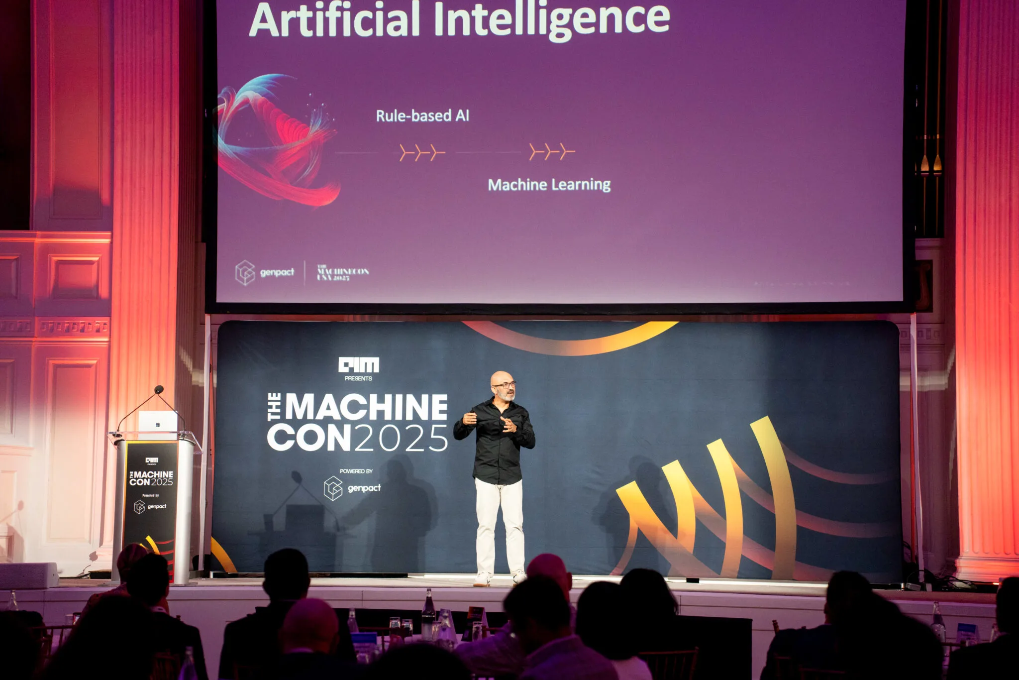 Speaker presenting on stage at MachineCon New York 2025