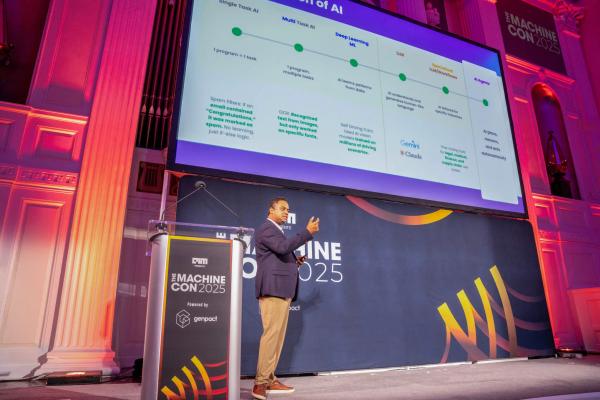 Speaker presenting on main stage at MachineCon New York 2025