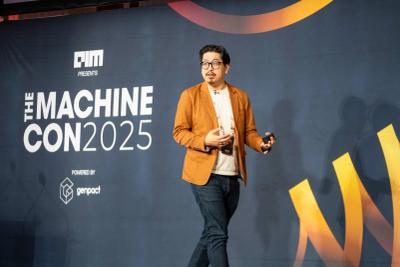 Speaker presenting on stage at MachineCon New York 2025