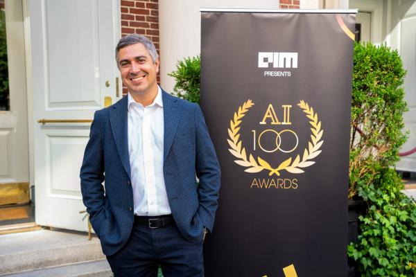Smiling man by AI100 banner · 2025